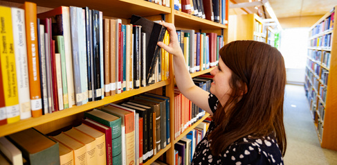 Library Shelves and Student